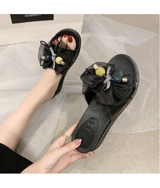 Slope heel fashion slippers women 2020 summer new bow one word drag outside women's shoes manufacturers wholesale group buying trend

