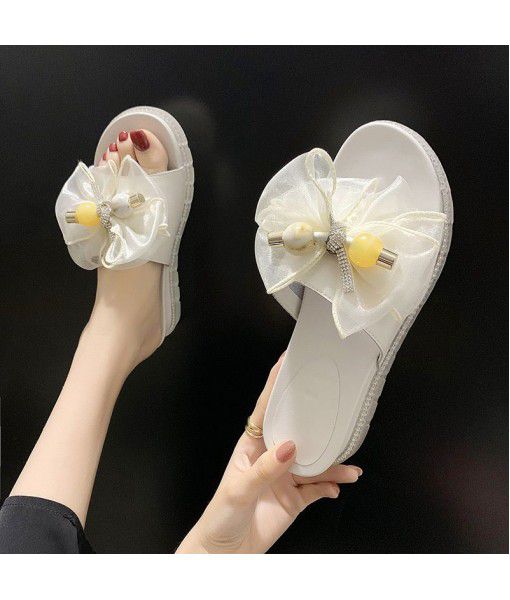 Slope heel fashion slippers women 2020 summer new bow one word drag outside women's shoes manufacturers wholesale group buying trend
