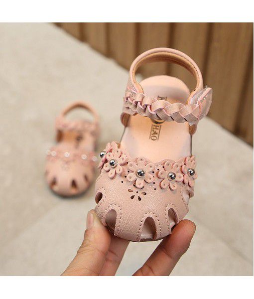 Spring and summer 2019 new round head semi Baotou knitting soft sole baby shoes sandals Korean small flower hollow out girl's shoes